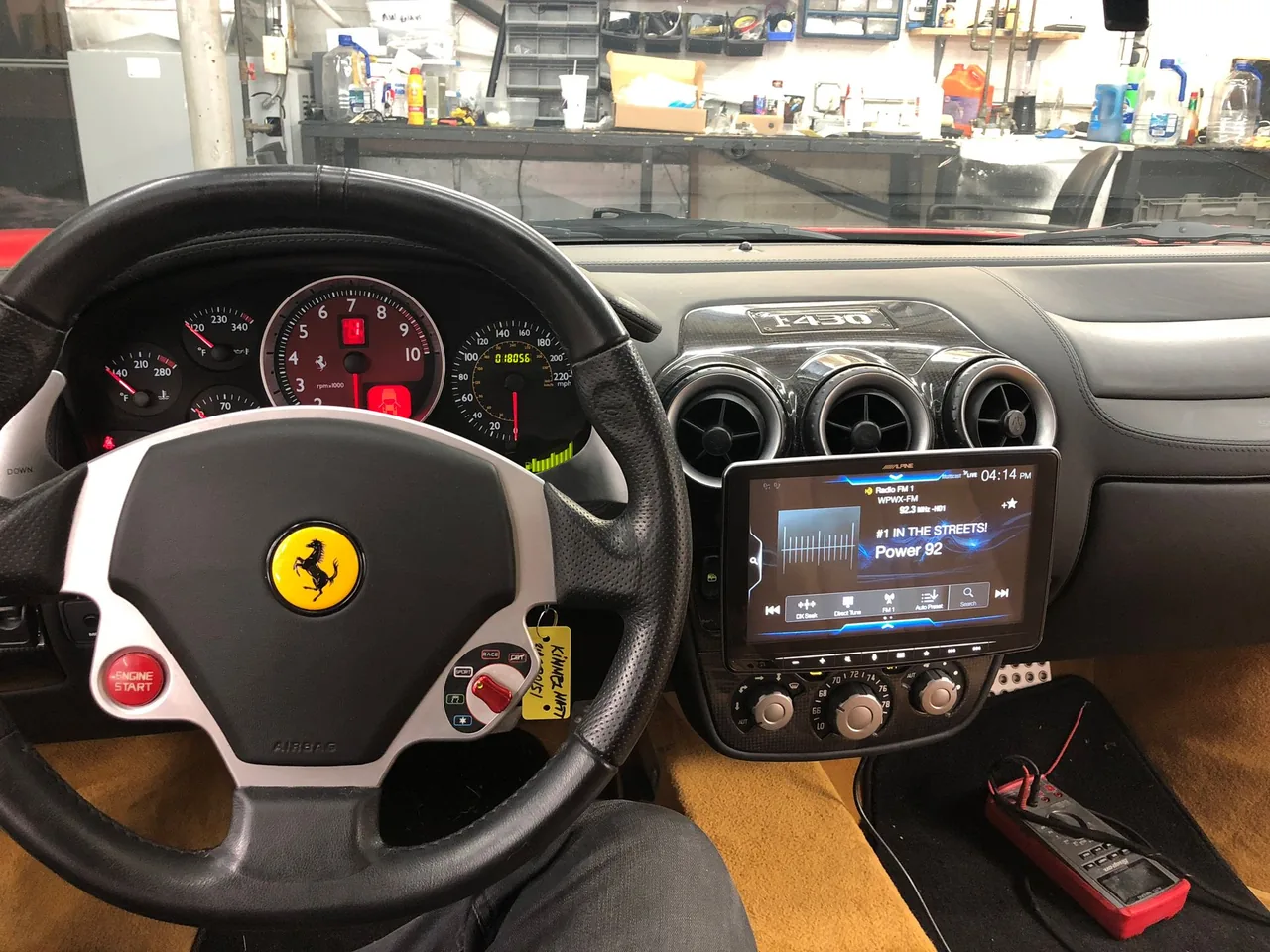 Ferrari dashboard with a new Alpine radio installed by Car Teks